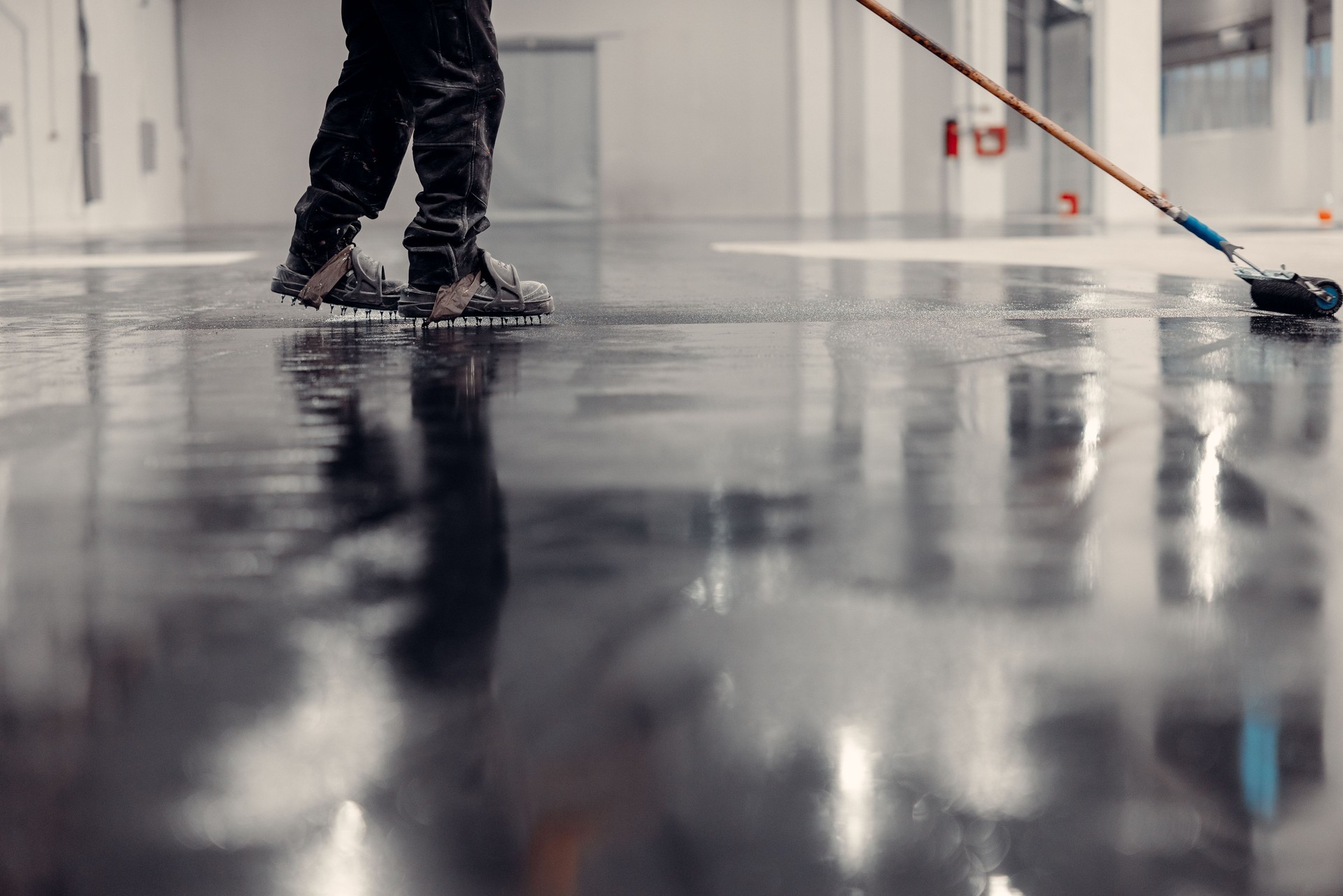 Epoxy floor coating in an industrial warehouse.